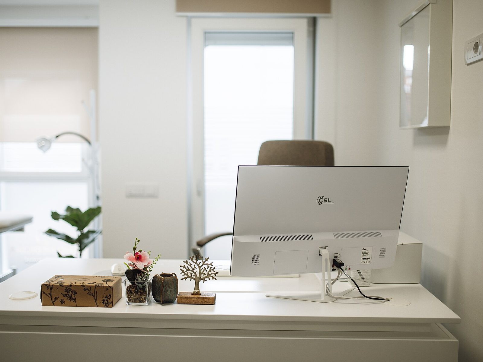 A tidy modern office desk with a computer